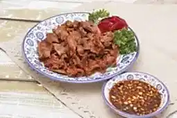 Закуска из желудков куриных с соусом и чесноком (200 гр.)